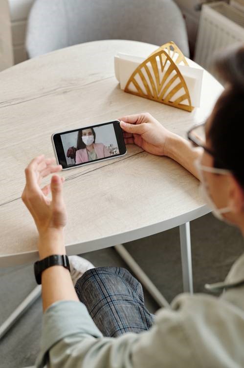 Man videoconferencing his doctor